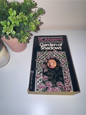 Garden of Shadows Paperback Book - Black Cover with Pink Floral Design